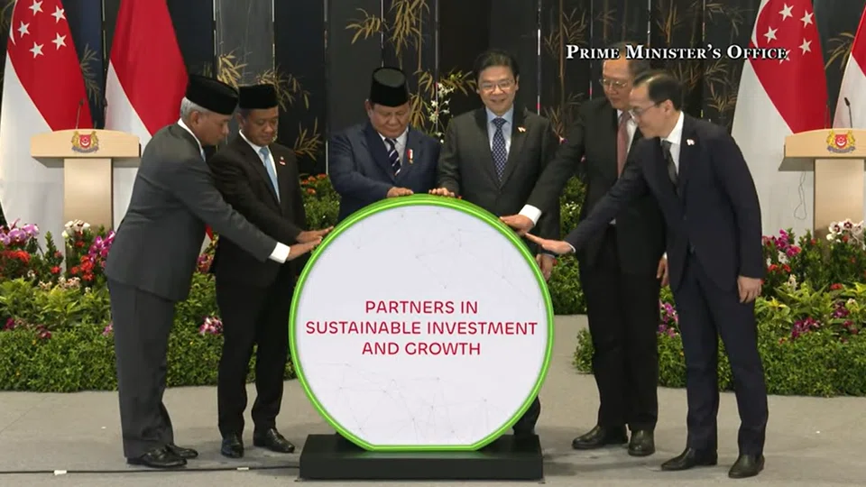 PM Lawrence Wong (third from right) and Indonesian President Prabowo Subianto (third from left) officiate a milestone ceremony to mark both countries' shared commitment to support green economy projects.  Also pictured are Minister-in-charge of Energy and Science & Technology Dr Tan See Leng (second from right), Permanent Secretary at the Ministry of Trade and Industry Dr Beh Swan Gin (extreme right), head of Indonesia’s upstream oil and gas authority Mr Djoko Siswanto (extreme left) and Minister for Energy and Mineral Resources Dr Bahlil Lahadalia.  