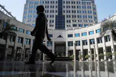 A person walks past Bank Indonesia's headquarters in Jakarta. Indonesia exported a record US$292 billion in 2022, driven by high global commodity prices.
