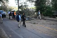 US Vice-President Kamala Harris walks with Augusta Mayor Garnett Johnson as they survey the damage from Hurricane Helene, in the Meadowbrook neighborhood of Augusta, Georgia, Oct 2, 2024.