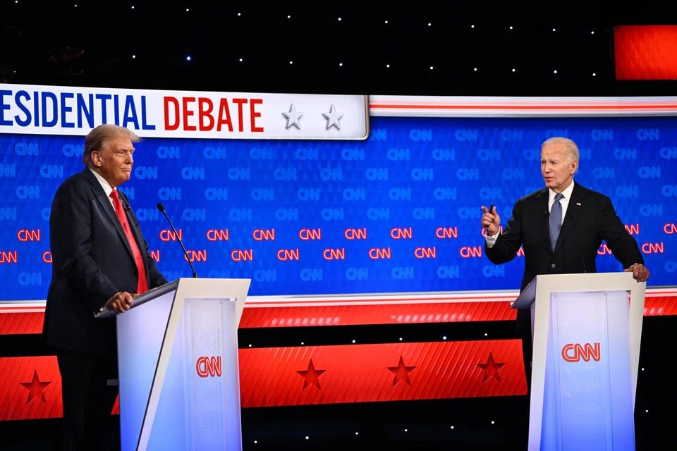 A raspy-voiced President Biden (right) struggled to deliver his lines and counter former president Donald Trump during the debate on Thursday.