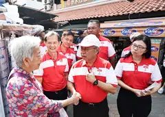 PSP's West Coast-Jurong West team greeting a resident. From left: Leong Mun Wai, Sumarleki Amjah, Tan Cheng Bock, Sani Ismail and Hazel Poa. 