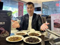 House of Seafood’s Francis Ng with plates of toasted insects. He will roll out 30 dishes featuring insects at its Punggol outlet once SFA approval is granted.