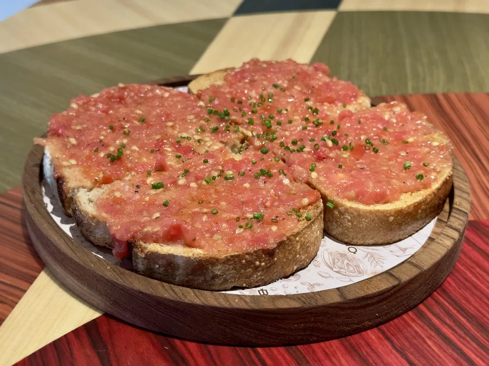 Crunchy toasted sourdough topped with garlicky tomatoes.