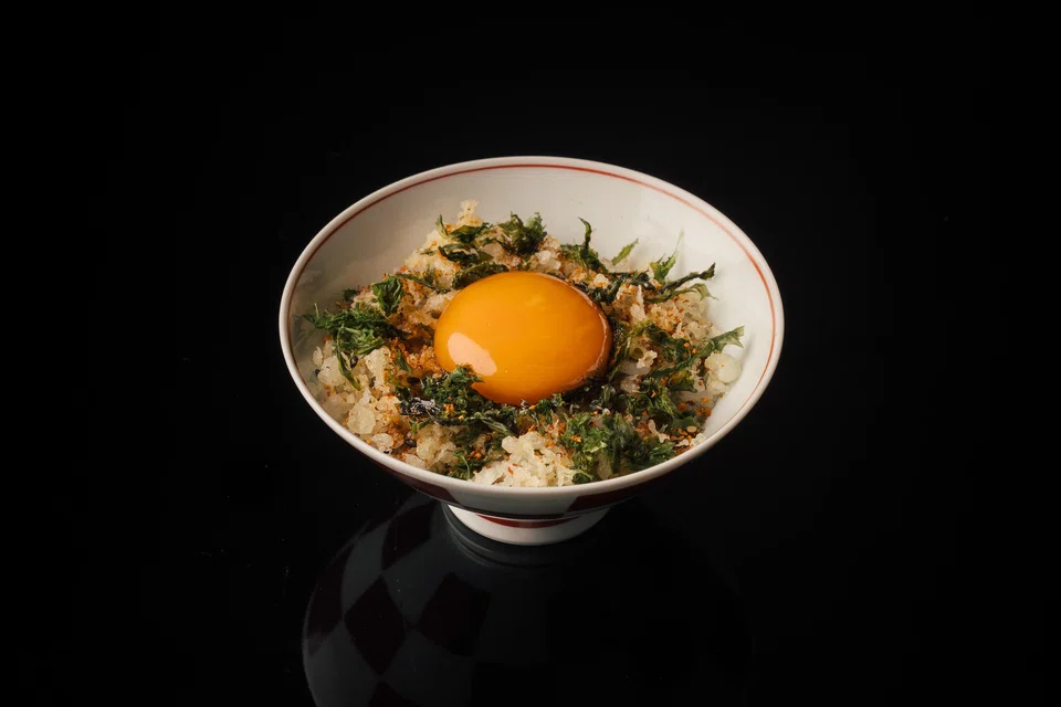 Claypot rice with marinated egg yolk.
