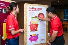 Minister for Education Desmond Lee (right) with Soh Ying Si, deputy head of Melrose Home, Children's Aid Society; the minister has called for a sustained effort to support care leavers.