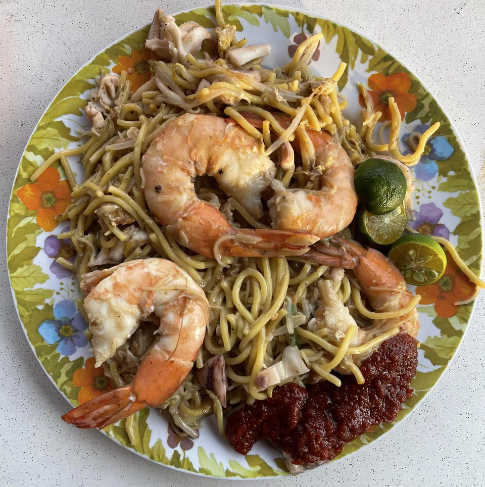 Swee Guan Hokkien Mee serves up charcoal-fried yellow and white noodles are steeped in a rich seafood-based broth.