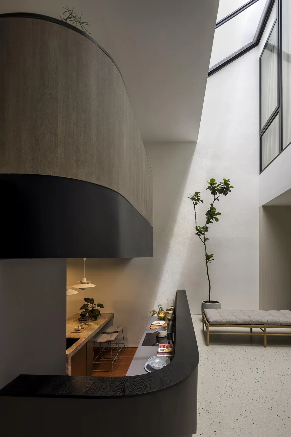 The original design of the house features a split-level living and sunken kitchen.