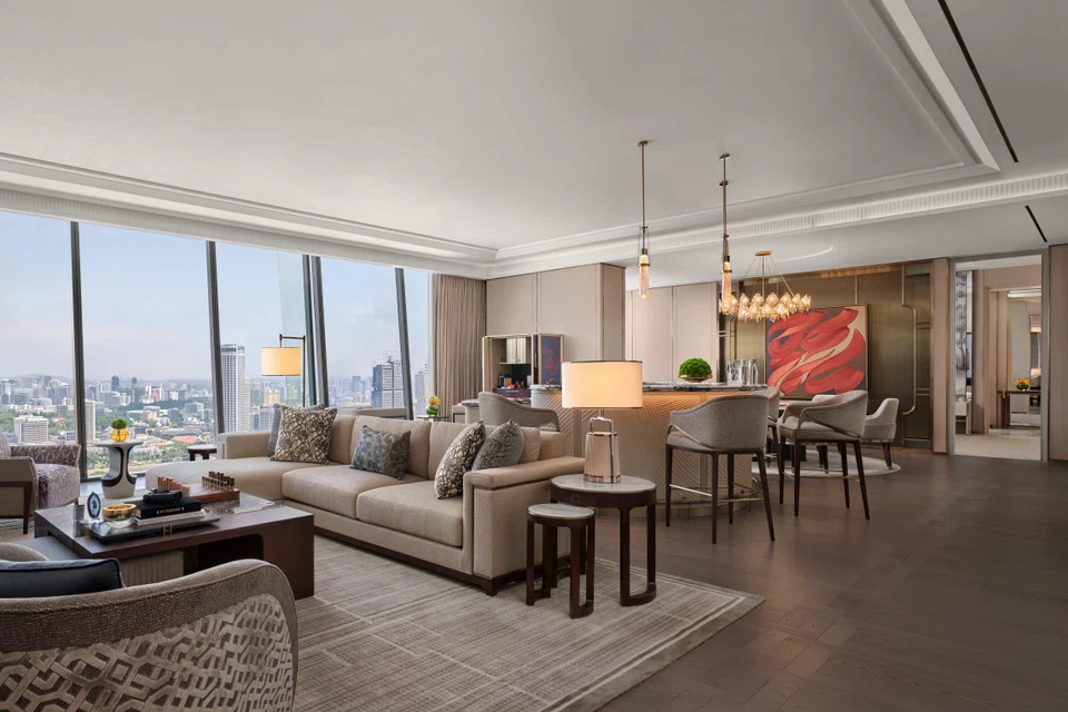 The Presidential Suite at MBS has a living and dining area and a bar. MBS is spending US$1.75 billion for its reinvestment programme.