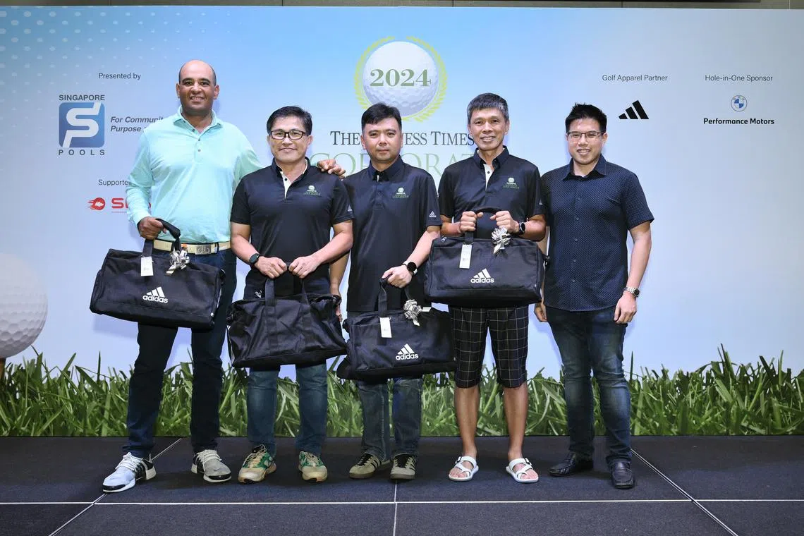 (From left) Team Singapore Pools golfers Samir Bedi, Tay Boon Khai, Kevin Pang and Gerald Ng, after receiving their prizes from The Business Times news editor Lee U-Wen at Tanah Merah Country Club.