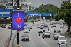 Traffic arriving from Singapore's Woodlands checkpoint into Johor Bahru on Oct 1. 