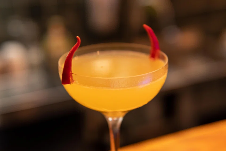 The Devil, one of the signature cocktails at tarot-themed bar 3 of Cups, is sweet but strong, with a fiery kick.