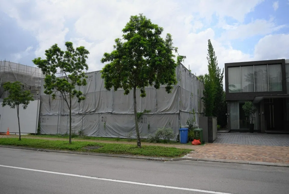 The 1,816.3 sq m site (left, covered by sound barrier) at 69 Ocean Drive in Sentosa Cove, offers unblocked views of the sea and the Central Business District. 