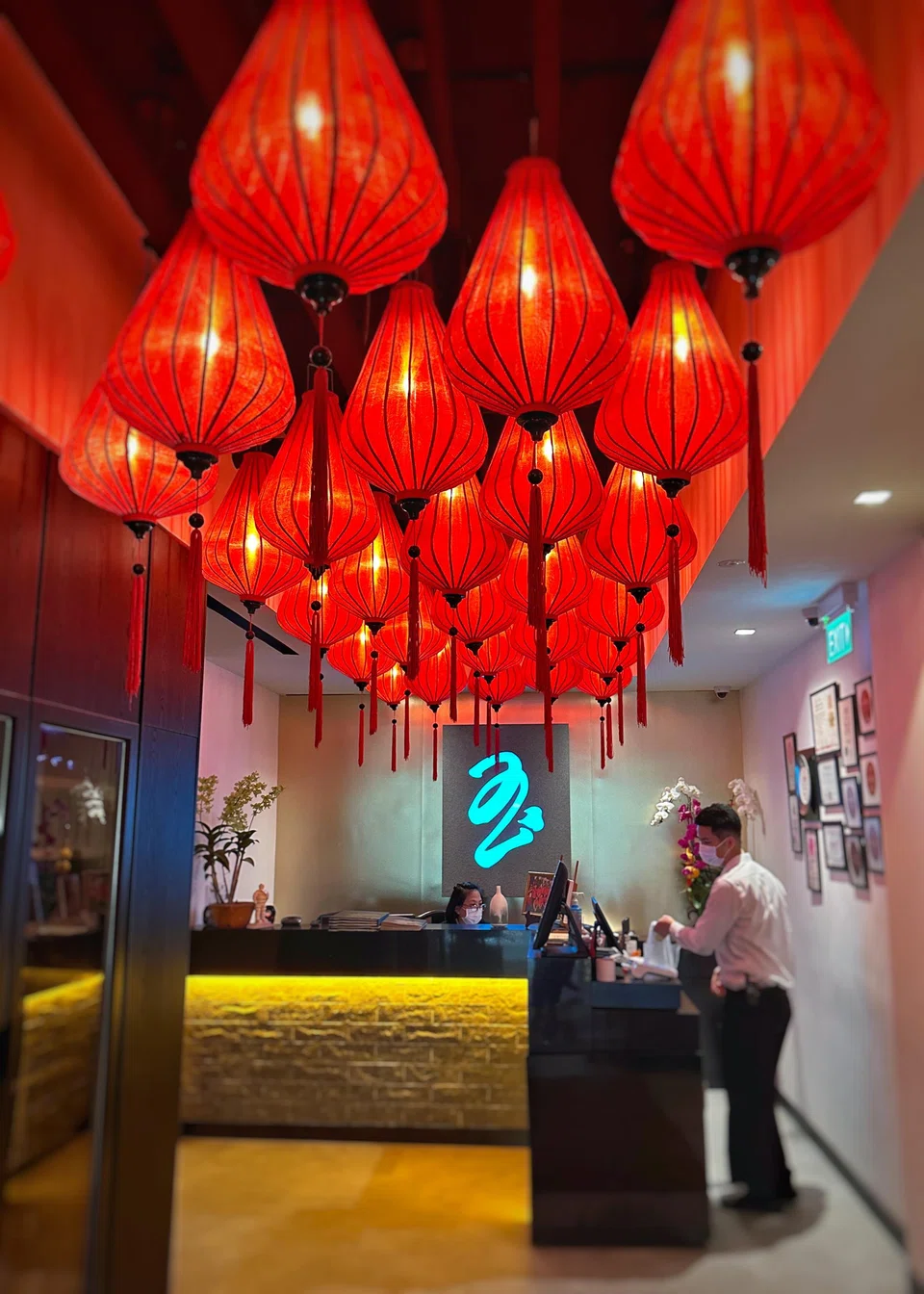 The restaurant's bright red lanterns light up its decor.