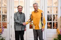 Malaysian Prime Minister Anwar Ibrahim (left) with Prime Minister Lee Hsien Loong at the Istana during the 10th Singapore-Malaysia Leaders' Retreat, where the two countries signed memoranda of understanding to further cooperation.