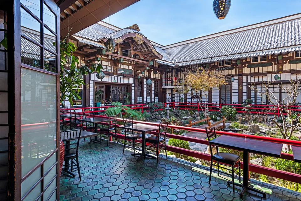 The property features an open-air courtyard, garden, shrines and temples.