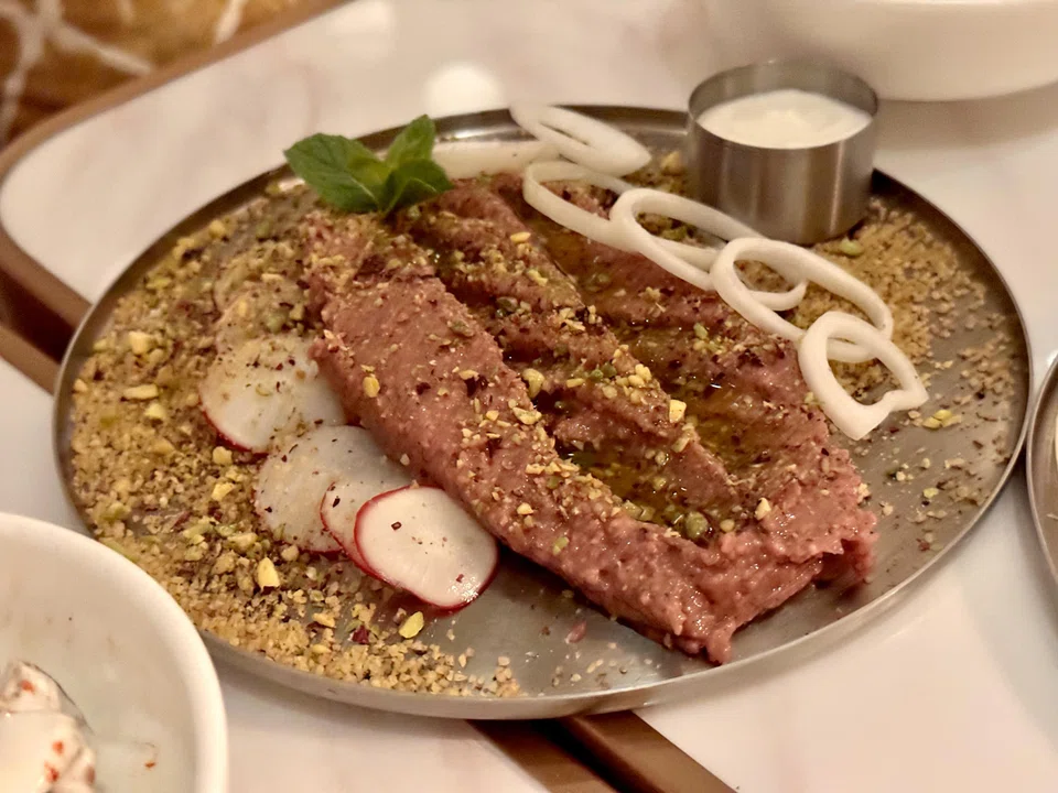 Kibbeh Nayyeh is a lamb tartare that's an acquired taste.