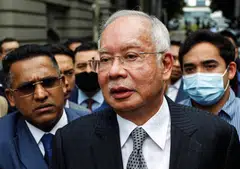High Court judge Mohamed Zaini Mazlan said state prosecutors failed to provide sufficient evidence to prove their case that Najib Razak (above) tampered with an official audit report on scandal-wracked state fund 1MDB. 
