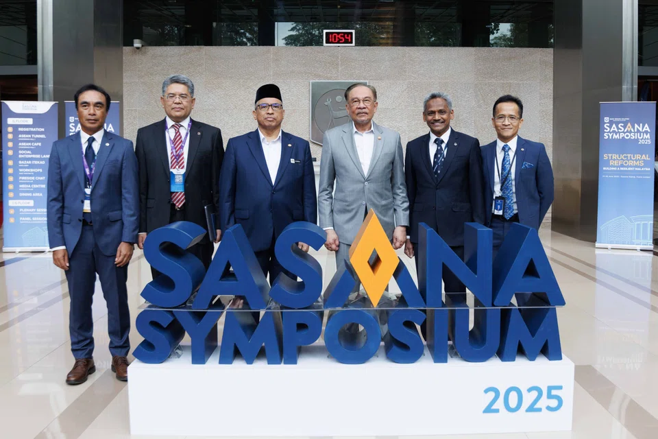 From left: Bank Negara Malaysia deputy governors Adnan Zaylani Mohamad Zahid and Marzunisham Omar, Malaysia's chief secretary to the government Shamsul Azri Abu Bakar, Malaysian Prime Minister Anwar Ibrahim, Bank Negara governor Abdul Rasheed Ghaffour and Bank Negara deputy governor Aznan Abdul Aziz at the Sasana Symposium 2025.