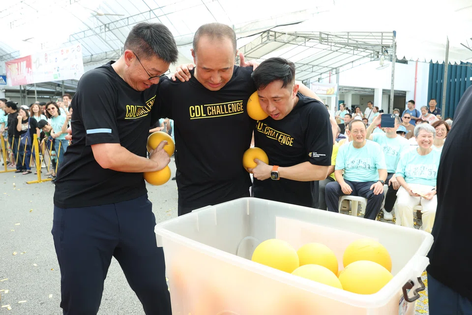 Sherman Kwek (centre), group chief executive of CDL, leading the CDL Challenge, an annual signature charity event at Assisi Fun Day.