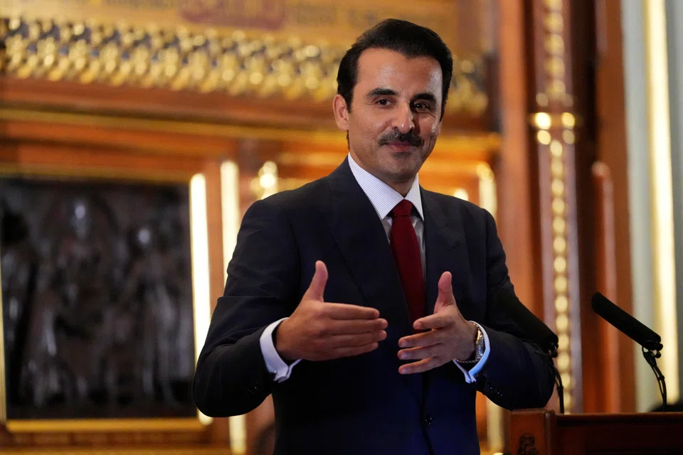 The Emir of the State of Qatar Sheikh Tamim bin Hamad Al Thani gestures as he visits the Palace of Westminster and addresses the house in London, Britain, Dec 3, 2024.     
