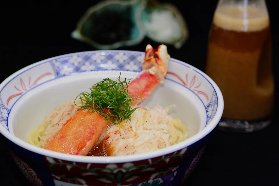 Crab ramen features an intense thick broth and chewy noodles.