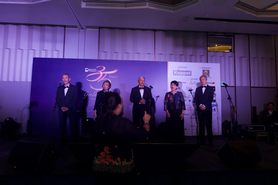 Graduates of the Voices for Hope programme performing at Dementia Singapore's 35th anniversary gala dinner. The 10-week programme is among those that will be supported by Keppel's donation.