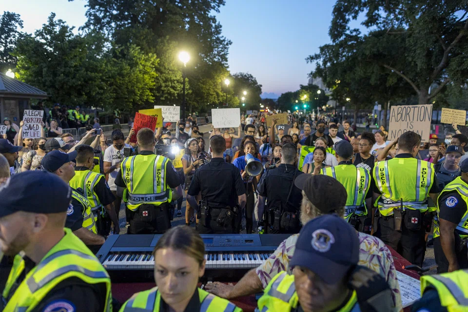 Capitol Hill police officers keep protesters separated in the wake of the decision overturning Roe v. Wade outside the US Supreme Court on June 25, 2022 in Washington, DC.  v. Wade case and erased a federal right to an abortion.
