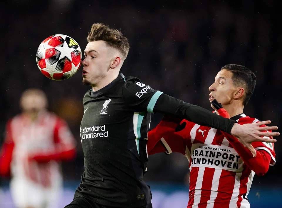Liverpool's Conor Bradley (left) in action against PSV Eindhoven on Thursday in the final round of group games of this season's Champions League. Liverpool lost 3-2 but still topped the 36-team table.