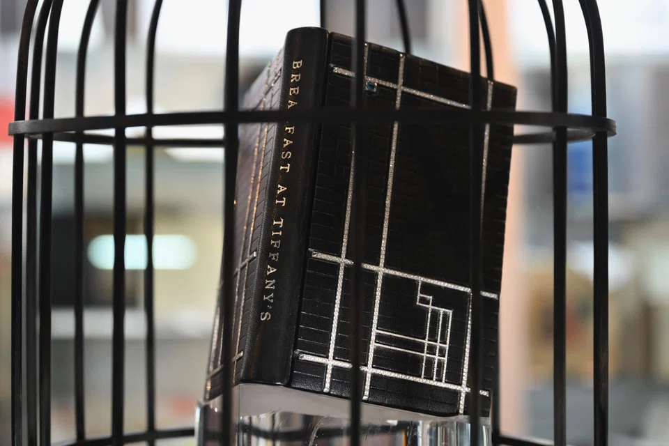 The one-of-a-kind volume, on display at the New York International Antiquarian Book Fair, is signed by the author and decorated with almost 30 carats of diamonds and a sapphire.