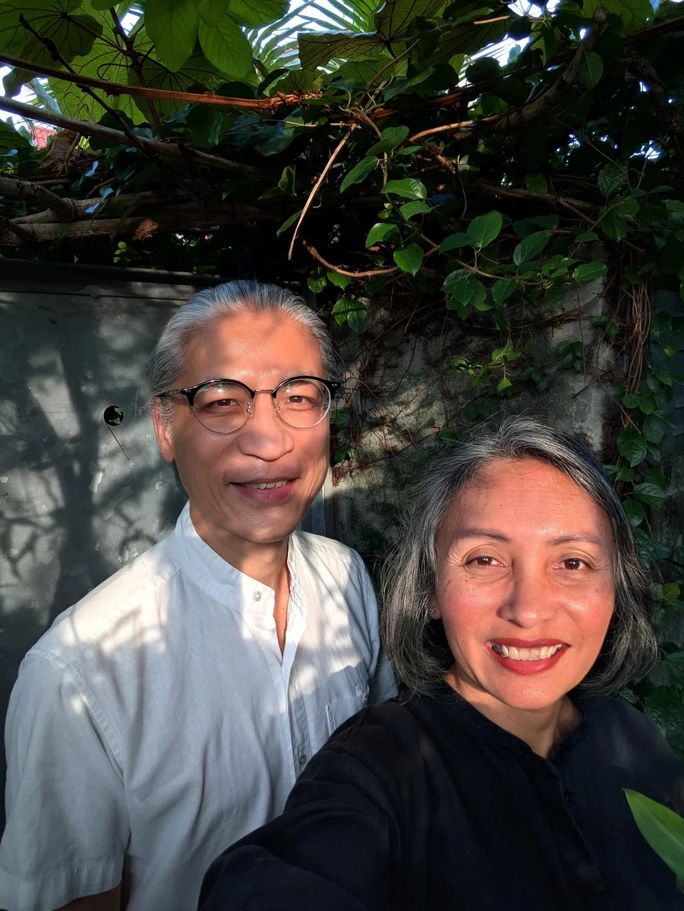 Minh Le Tien (right) and wife Emylia Safian.