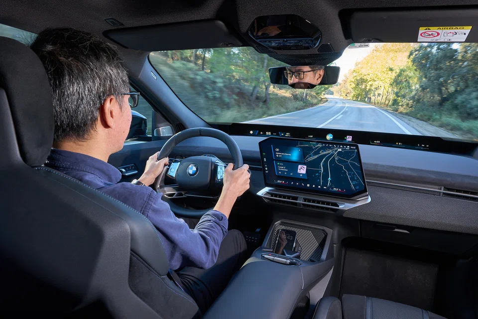 The 17.9-inch touchscreen is squished down into a parallelogram so it naturally angles toward the driver.
