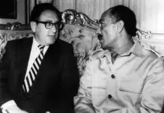 (US Secretary of State Henry Kissinger (L) meets with Egypt's President Anwar Sadat during his visit to Cairo on Nov 7, 1973. On Oct 6, 1973, on the Jewish holiday of Yom Kippur, an Arab military coalition led by Egypt and Syria launched a surprise attack in the Sinai Peninsula and the Golan Heights, territories occupied by Israel since the 1967 Arab–Israeli War. 