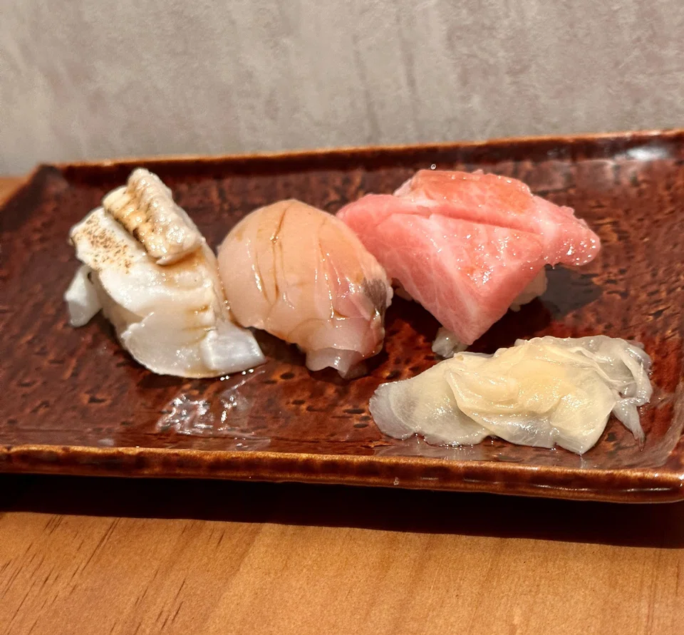 A trio of mixed sushi.