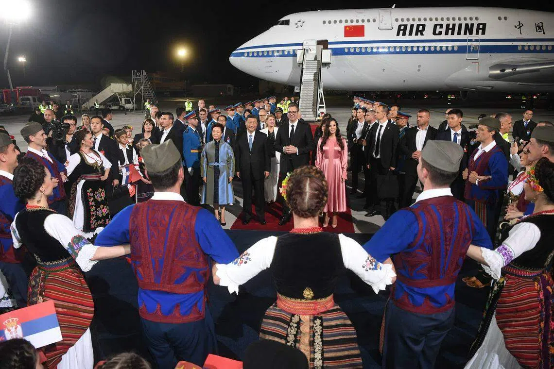 (From centre, second left) Chinese President Xi Jinping, his wife Peng Liyuan, Serbian President Aleksandar Vucic and his wife Tamara Vucic during a welcoming ceremony at Belgrade Airport, Serbia, May 7, 2024, on the second stop of Xi's European tour after a state visit to France. 