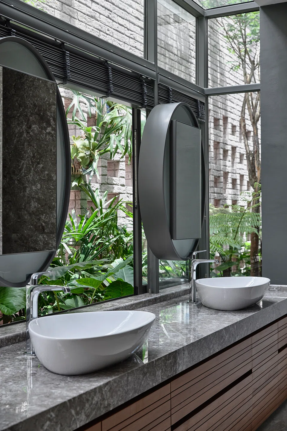 The master bathroom enjoys views of a side garden.