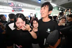 A South Korean worker (right), who was detained in a US immigration raid at a Hyundai-LG plant in Ellabell, Georgia, is welcomed by family members, Incheon, South Korea, Sep 12, 2025. 