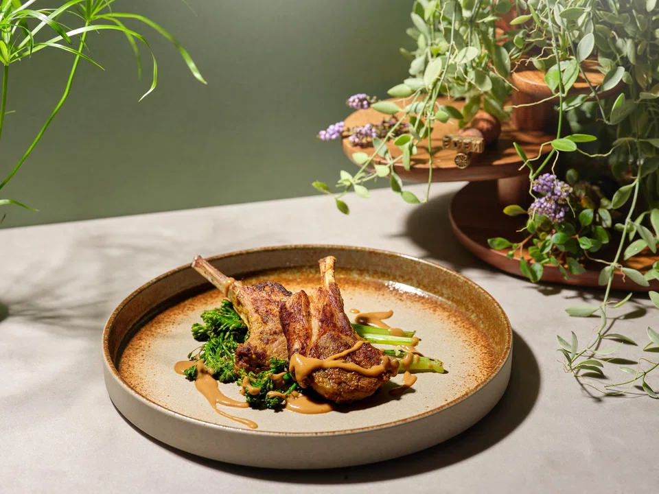 Satay lamb rack features meaty chops that are good enough on their own without the plain peanut sauce.