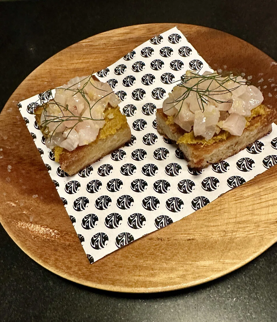 Shima aji and crab fat on buttery brioche toast.