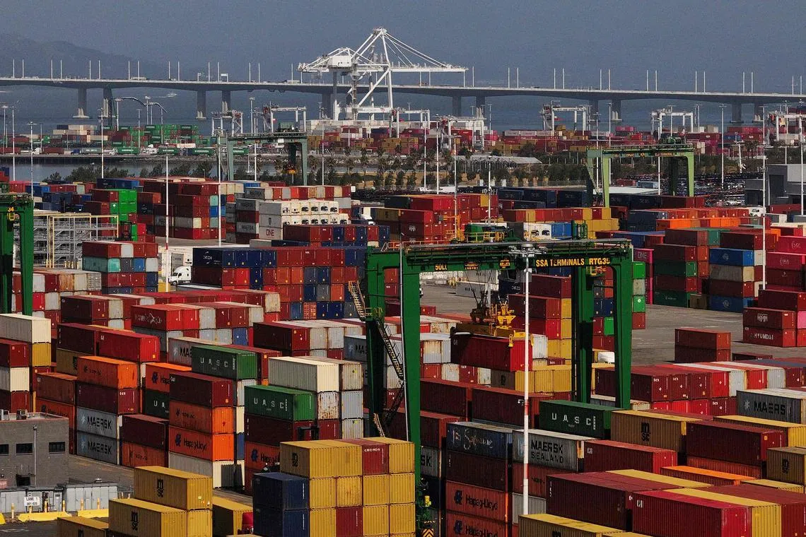OAKLAND, CALIFORNIA - APRIL 28: In an aerial view, shipping containers are stacked at the Port of Oakland on April 28, 2025 in Oakland, California. American importers are seeing a surge in canceled sailings by freight ships out of China as the Trump administration's tariffs continue to impact the world's economy.   Justin Sullivan/Getty Images/AFP (Photo by JUSTIN SULLIVAN / GETTY IMAGES NORTH AMERICA / Getty Images via AFP)