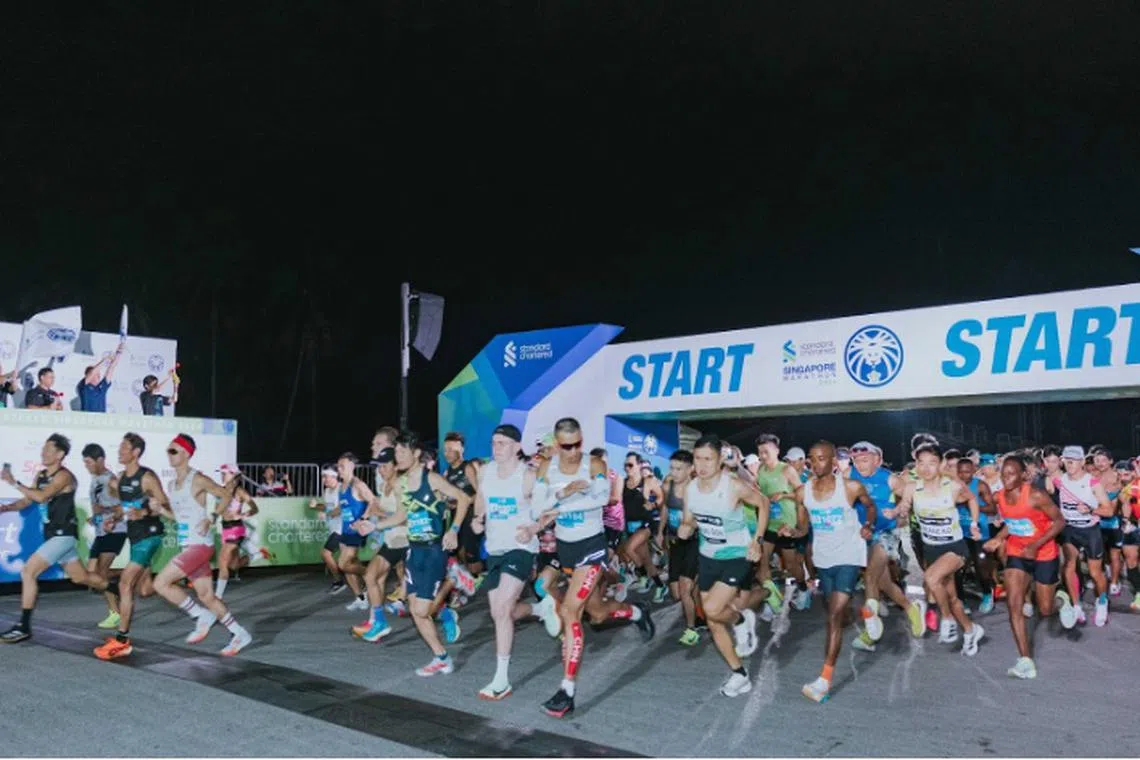 Thousands of runners of the Standard Chartered Singapore Marathon taking off at the start line of the Marathon category on Dec 1, 2024.