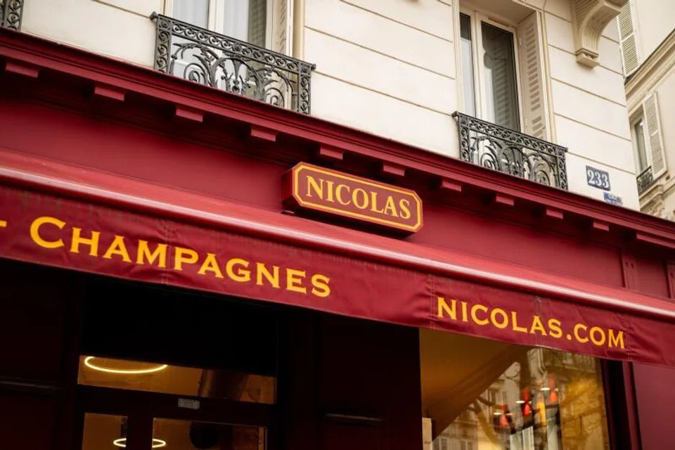 The frontage of a Nicolas wine store, operated by Castel Group, in Paris, France.Chief executive officer Gregory Clerc held on to his role as a director of a key corporate entity in Singapore after family members on Thursday failed to push through a vote to remove him.