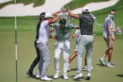 Sadom Kaewkanjana of Thailand being doused with water by his compatriots after winning the tournament at Sentosa’s Serapong Course in January 2022.