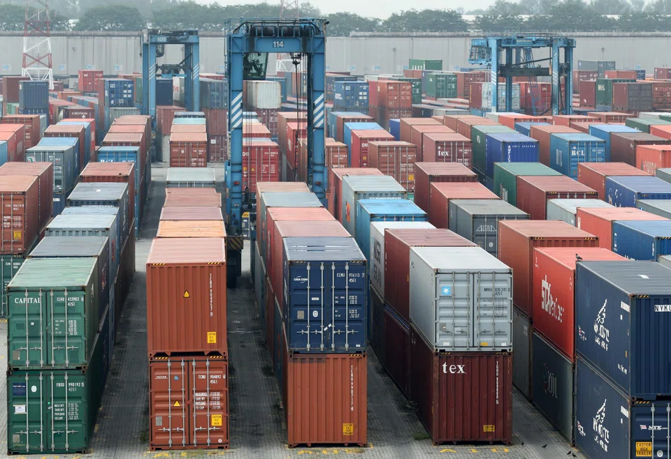 Shipping containers are stacked at North Point in Port Klang, Selangor, Malaysia.
