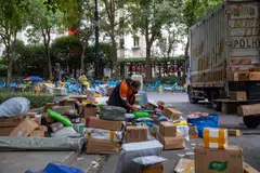 A delivery worker sorts out packages in Shanghai during the annual Singles' Day shopping festival.