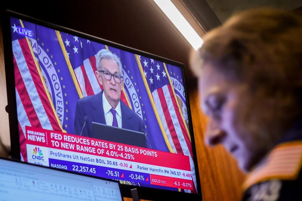 Fed officials lowered their benchmark rate by a quarter point and penciled in two more cuts this year following months of pressure from the White House to slash borrowing costs.