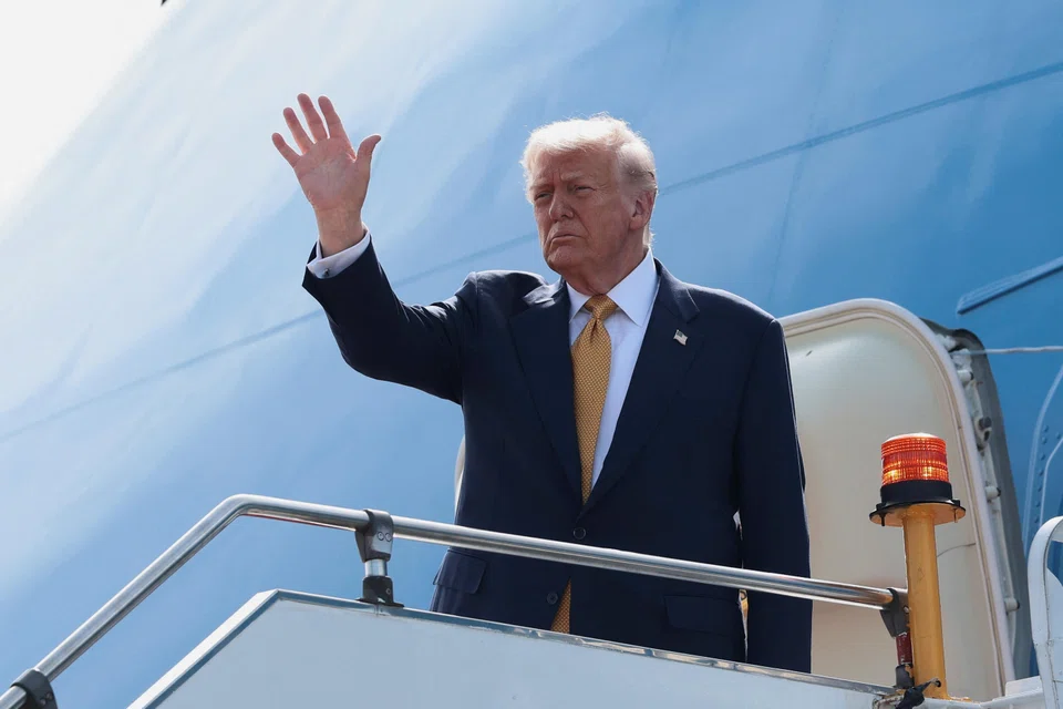 US President Donald Trump gestures while boarding Air Force One at Kuala Lumpur International Airport, Kuala Lumpur, Malaysia, Oct 27, 2025. 