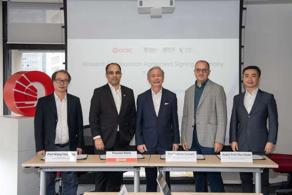 From left: Professor Wang Huaxiang from the School of Physical & Mathematical Sciences at NTU; Praveen Raina, head of group operations and technology at OCBC; David Koh, chief quantum adviser and chief of digital security and technology at MDDI; Professor Valerio Scarani, deputy director of NUS’ Centre for Quantum Technologies; and Associate Professor Zhu Feida, associate dean, partnership & engagement, at SMU’s School of Computing and Information Systems.
