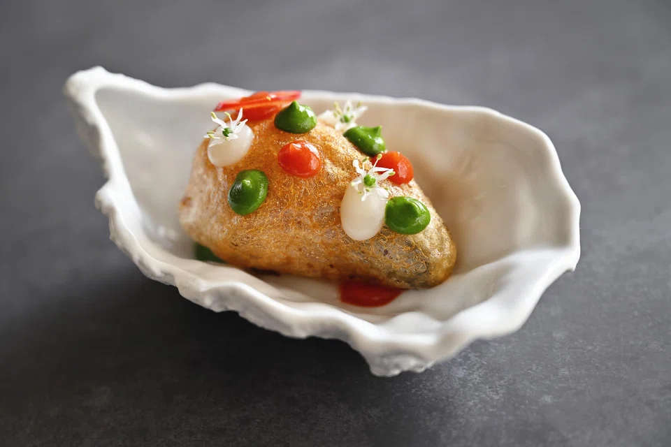 Deep-fried oysters with three different sauces.