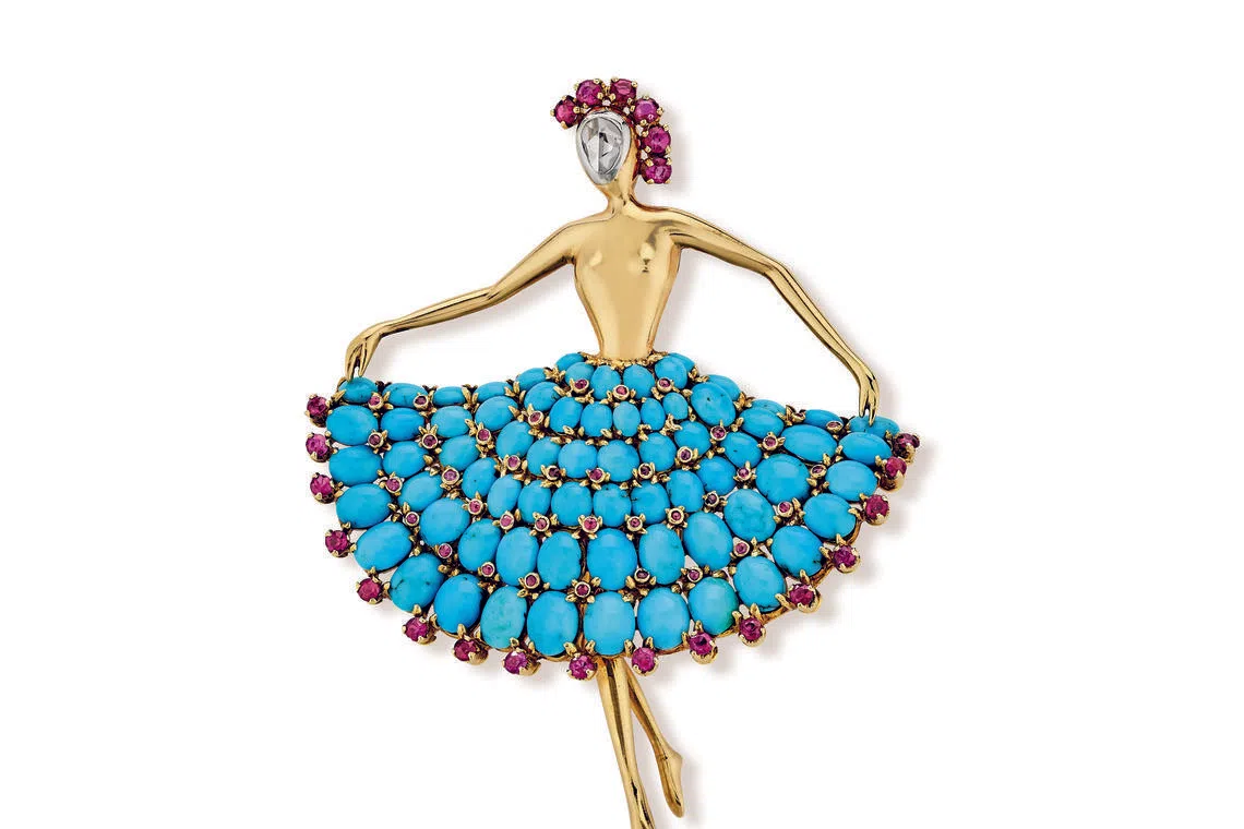 Dancer clip, 1952, in yellow gold and platinum with rubies, turquoise and diamond.