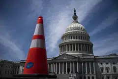 The deal still faces a difficult path to pass through Congress before the government runs out of money to pay its debts in early June.